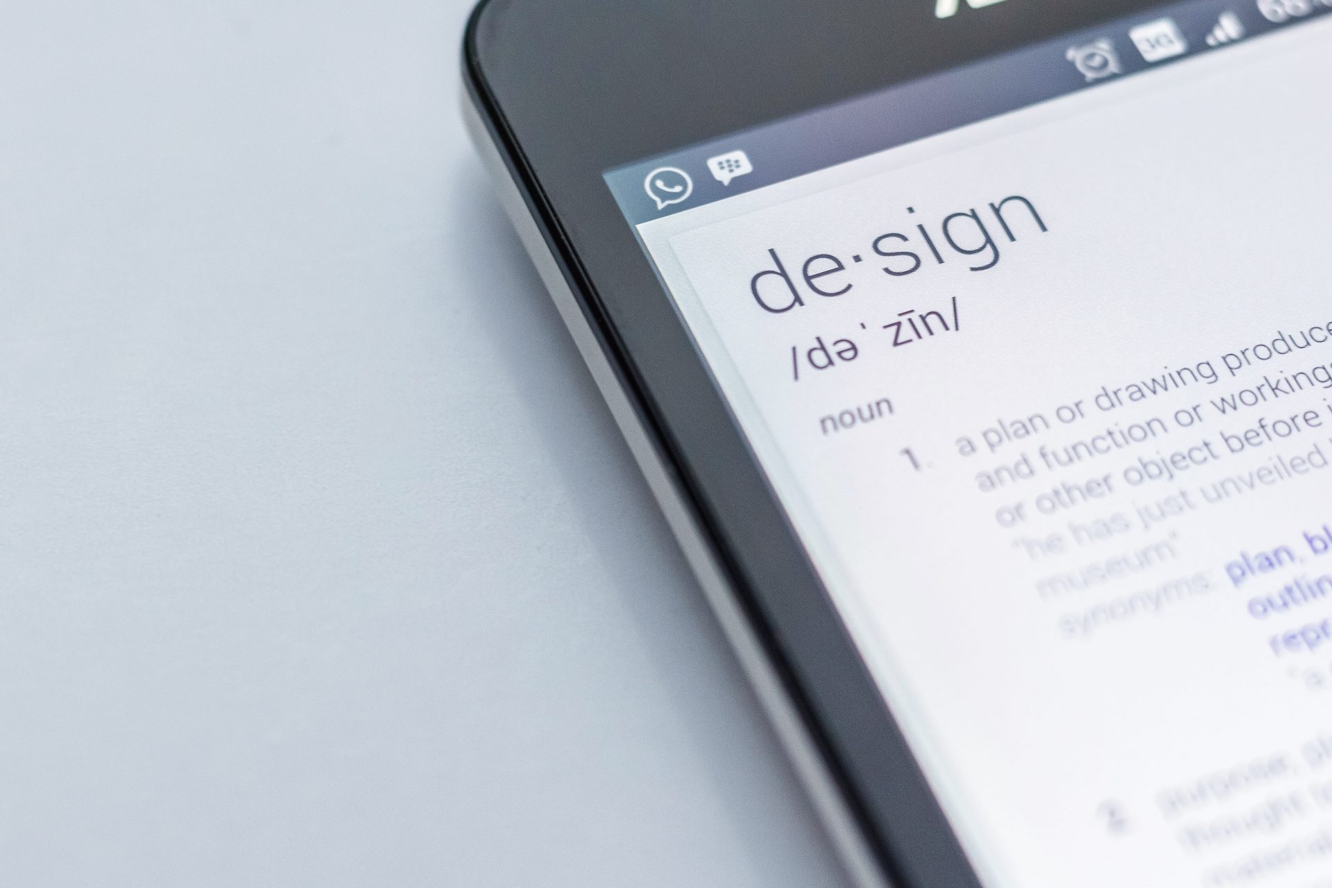 Smartphone with design dictionary page opened
